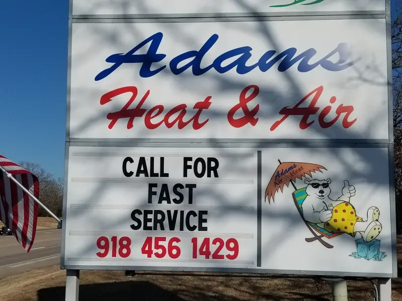 The Adams Heat & Air sign: Call for fast service